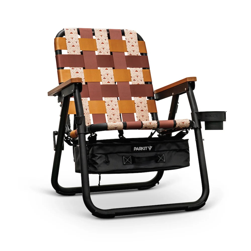 Folding PARKIT chair with woven seat and backrest featuring cowboy & cattle iconography on a white background