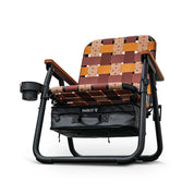 PARKIT Foldable chair with woven backrest hosting cowboy & ranch life iconography which includes a black carrying bag under the seat that serves as a cooler on a white background